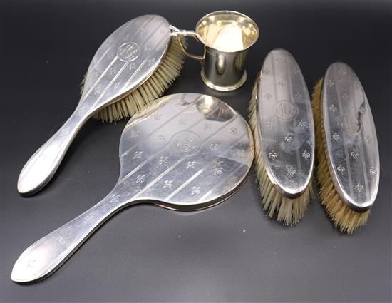 Silver Christening mug and a four-piece silver-backed dressing set